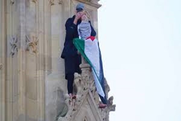 Barefoot man holding Palestinian flag climbs Big Ben Tower